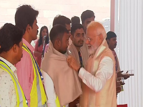 PM Modi honours workers who built new Parliament building