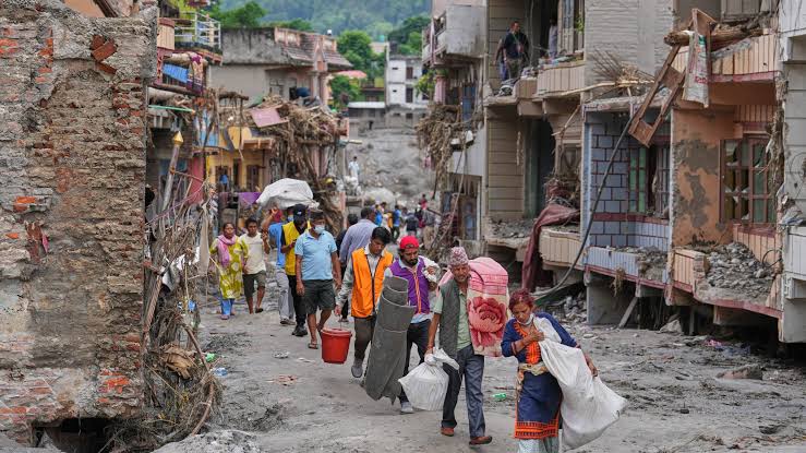 Nepal flood survivors join rescue and relief operations as they grieve, search for their loved ones