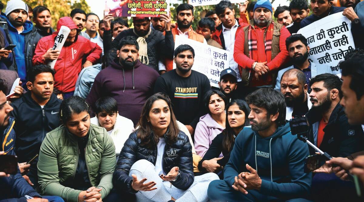 https://www.24x7liveindia.com/public/pulic/Protesting wresters wear black bands, Bajrang says their phone numbers being tracked
